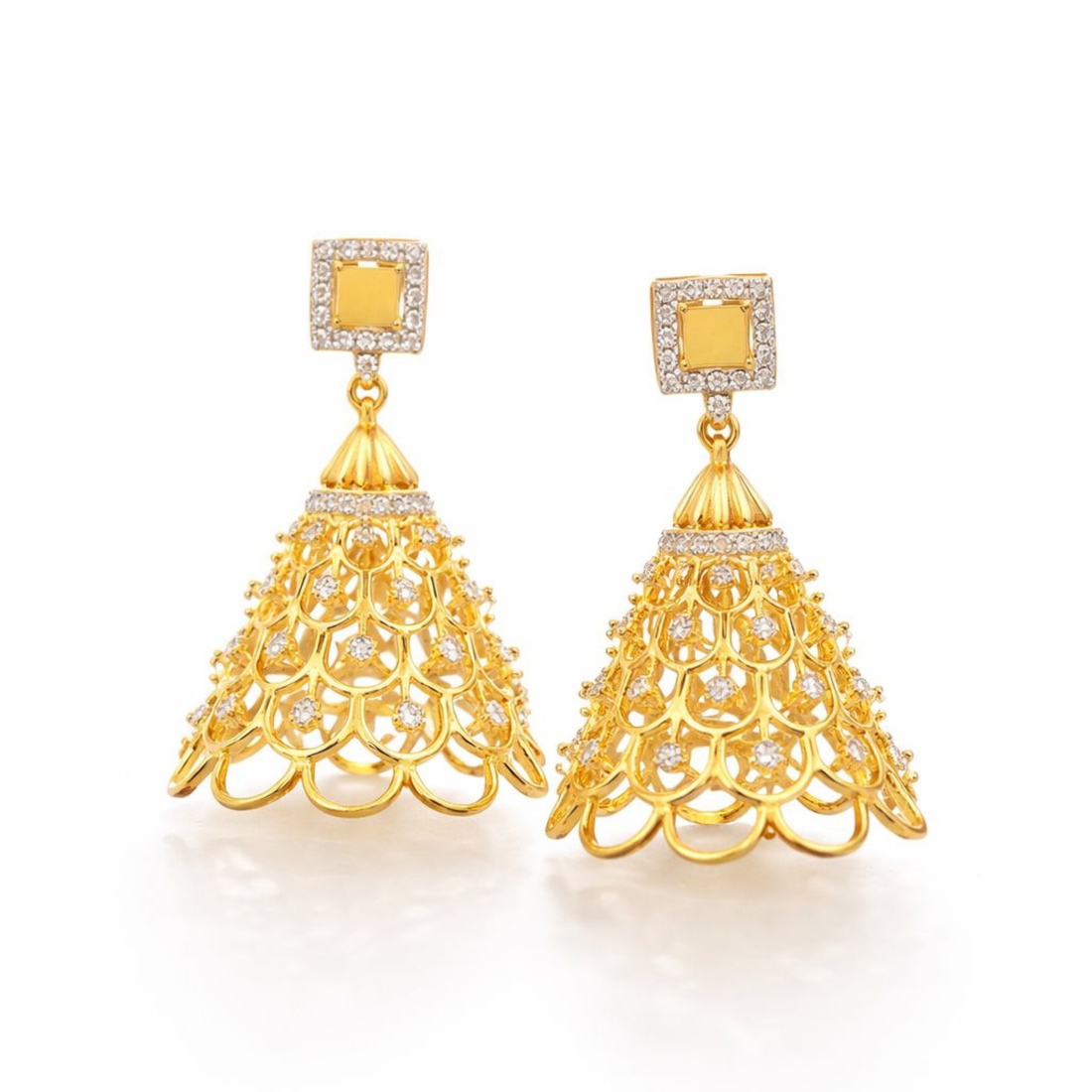 Gold earrings with intricate designs on a white background