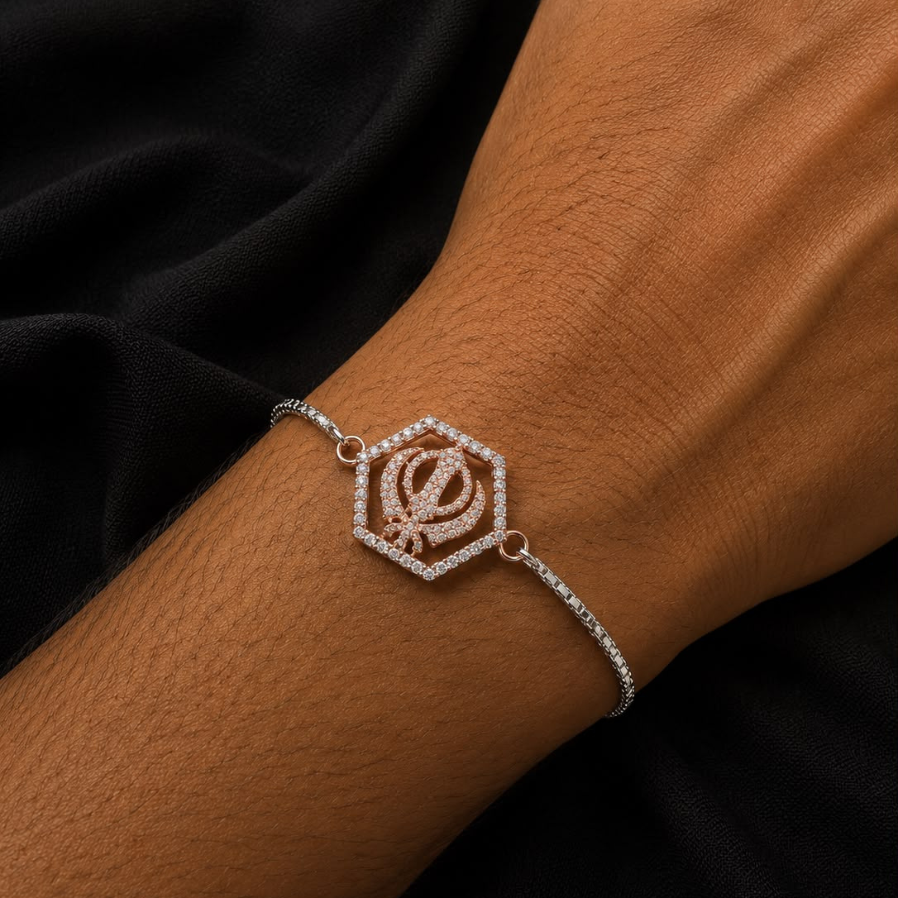 925 sterling silver Khanda Sahib Rakhi with spiritual Sikh symbol, rose gold finish pendant and silver chain for Raksha Bandhan gifting.