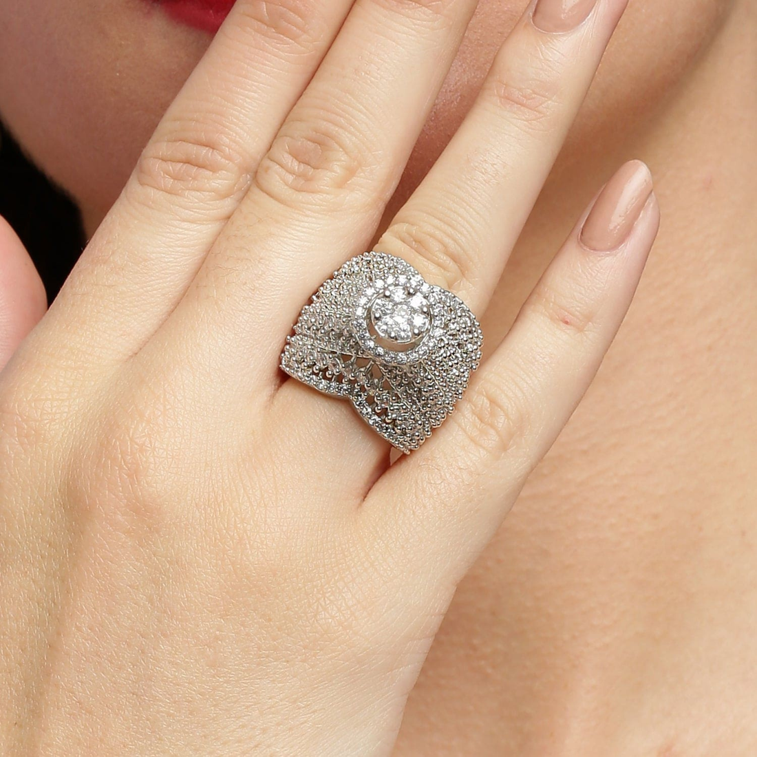 Close-up hand shot showcasing 925 sterling silver luxury diamond ring with premium finish.
