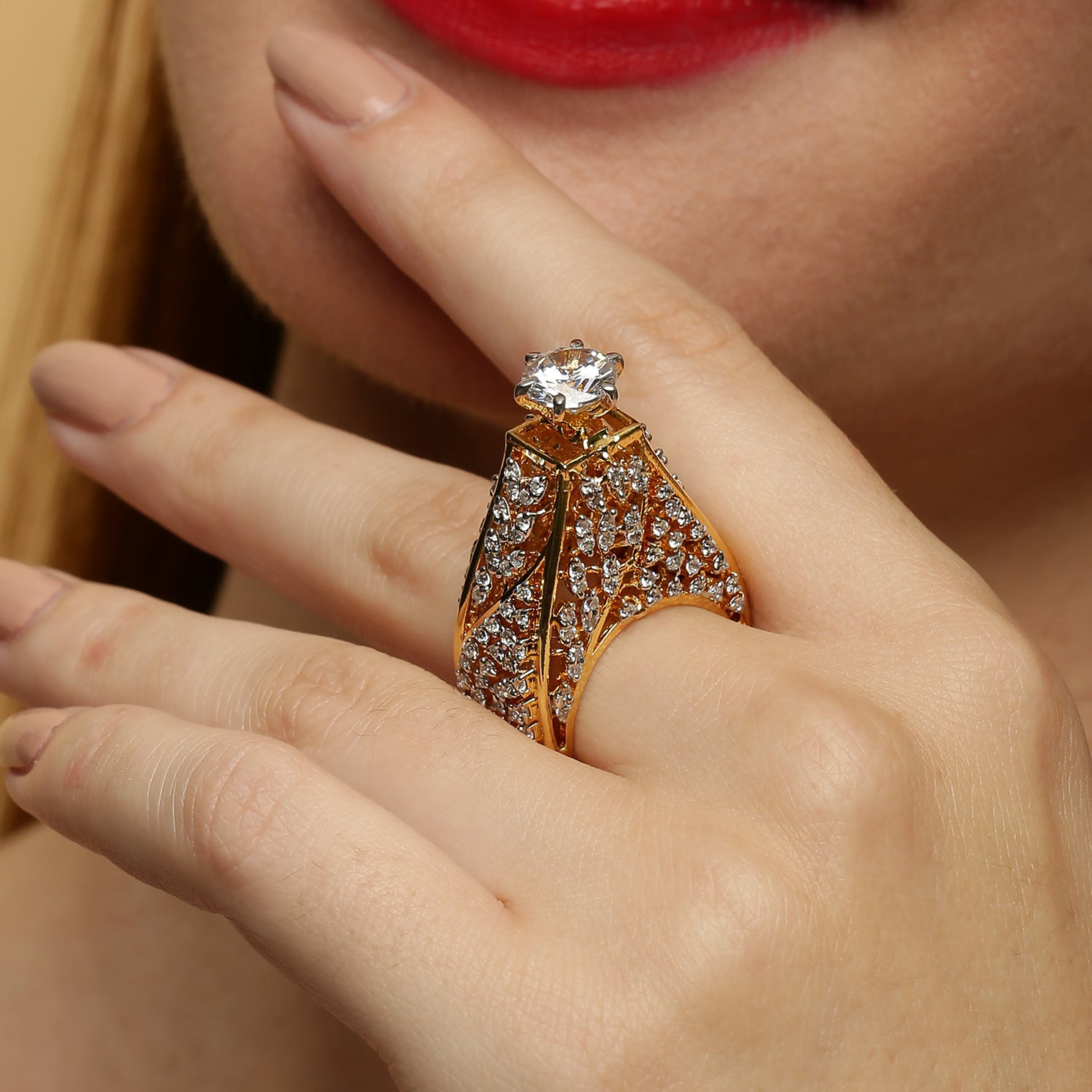 Close-up of model wearing luxury diamond ring in white polish