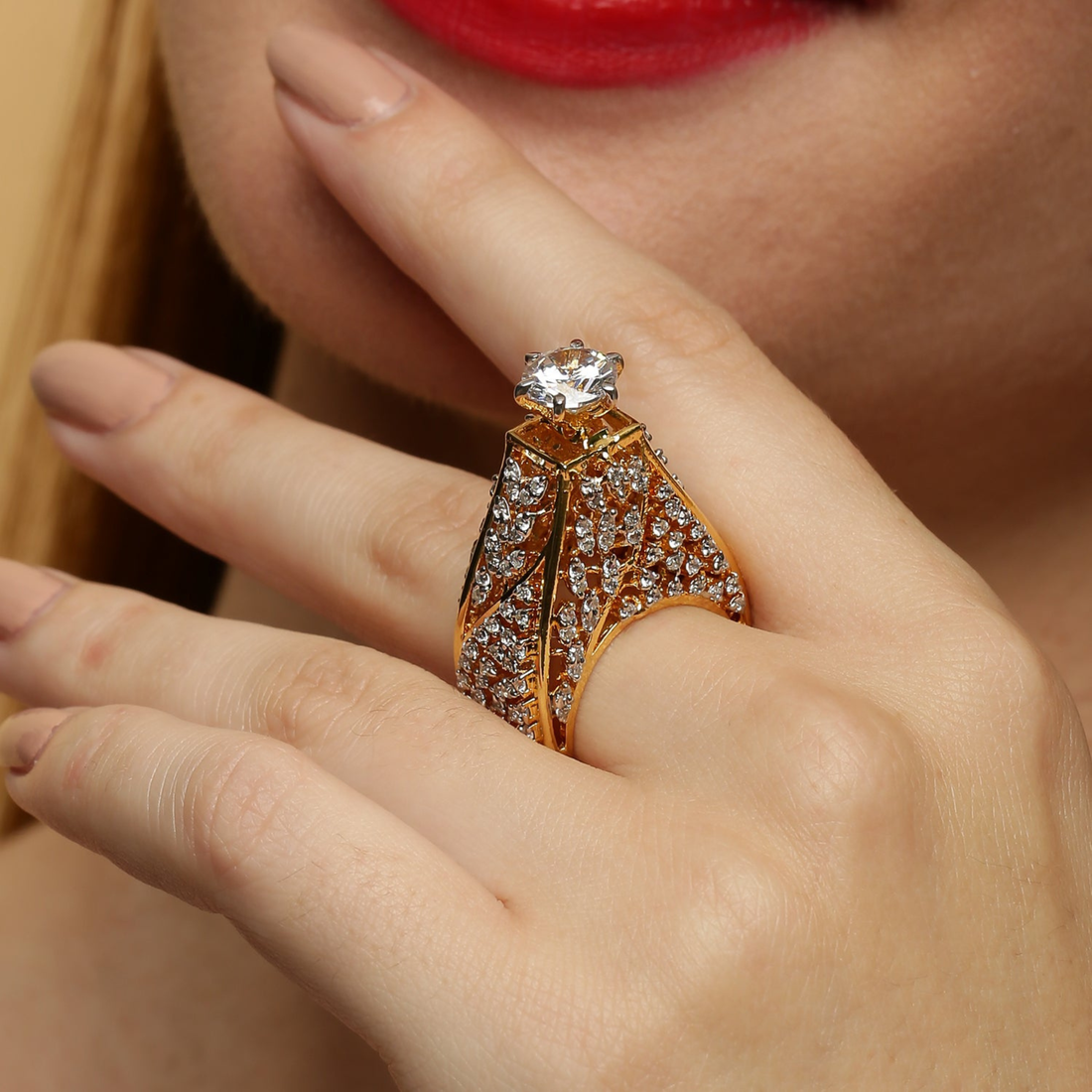Close-up of model wearing luxury diamond ring in white polish