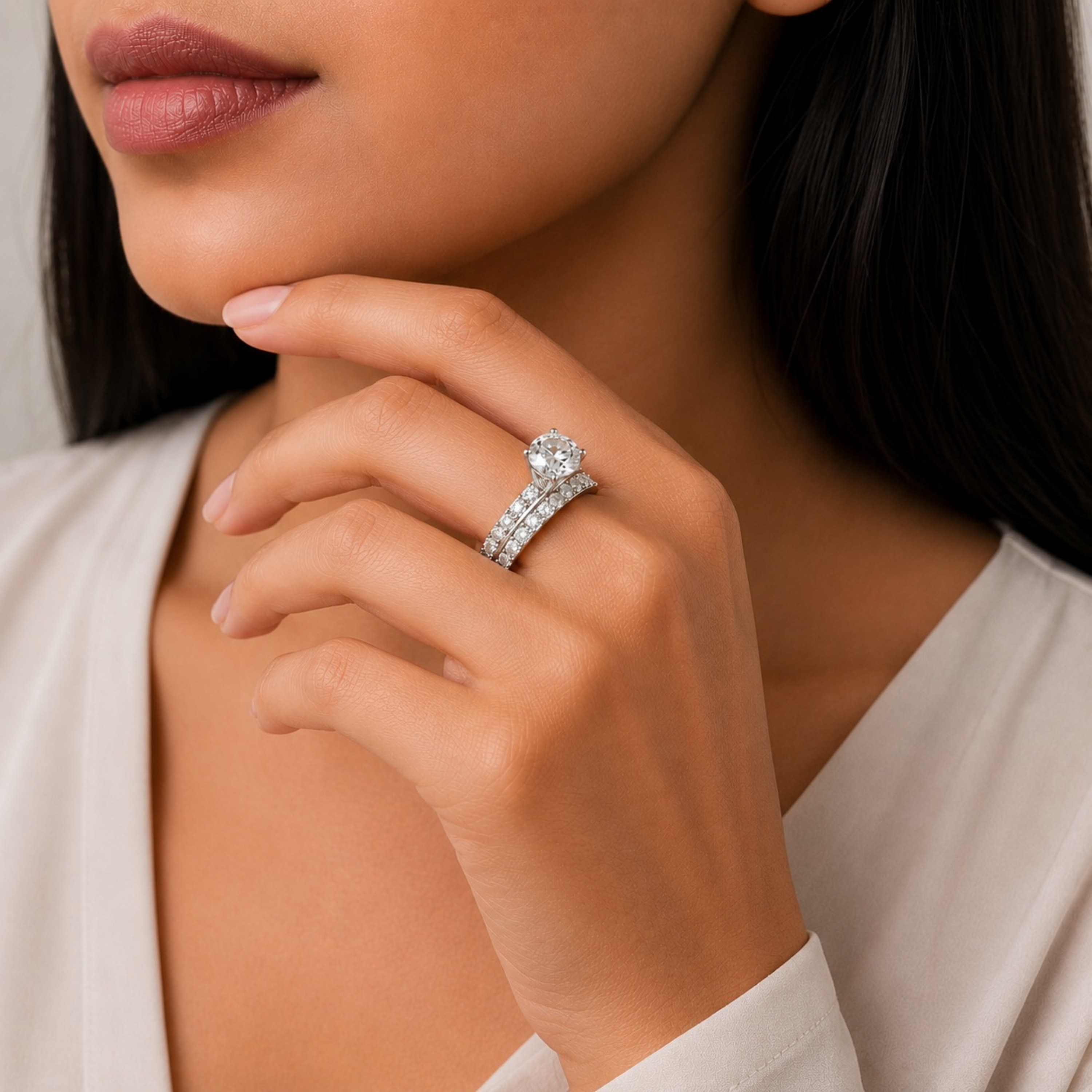 Elegant woman wearing a 925 Sterling Silver round solitaire split shank ring with sparkling CZ diamonds.