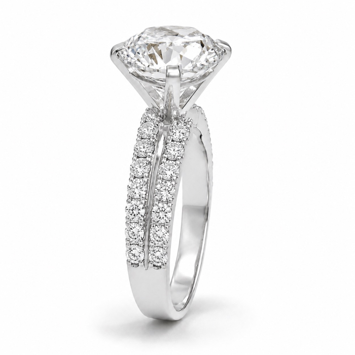 925 Sterling Silver round solitaire split shank ring with pavé CZ diamonds in white polish on a white background.