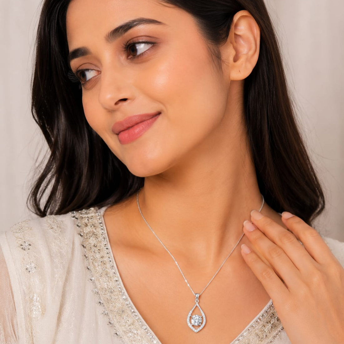 Model wearing auravelle Drop white polish pendant necklace with sparkling diamond white stone
