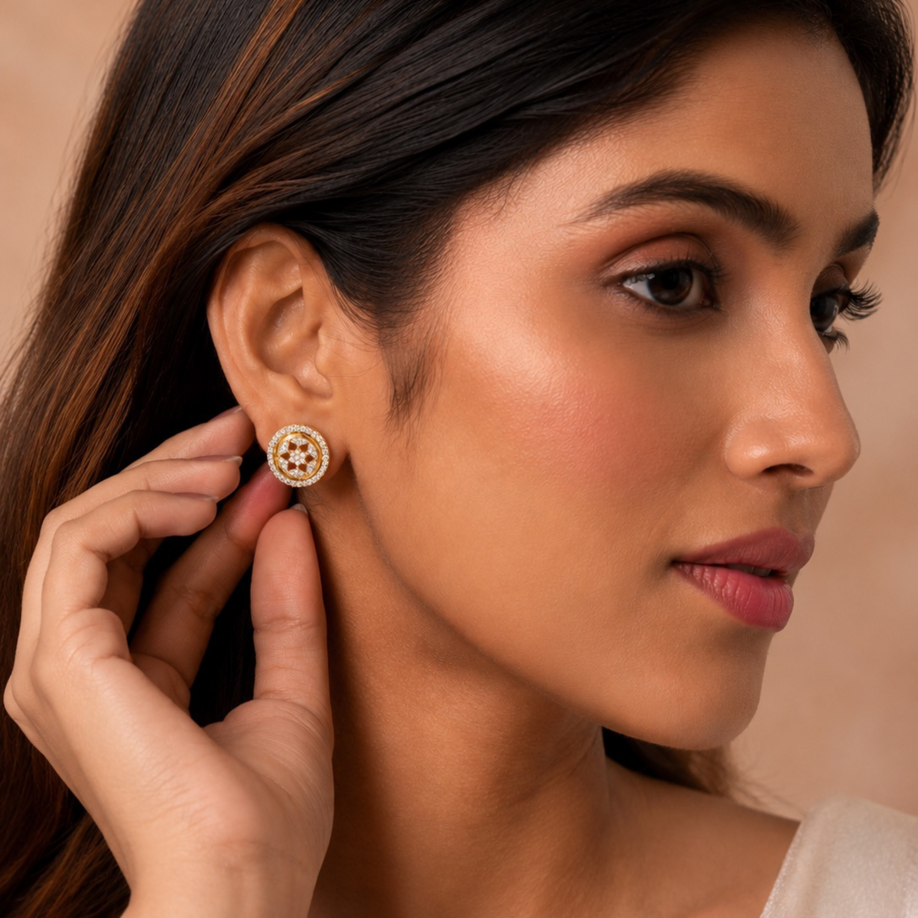 Beautiful woman wearing gold diamond stud earrings close-up luxury jewelry portrait