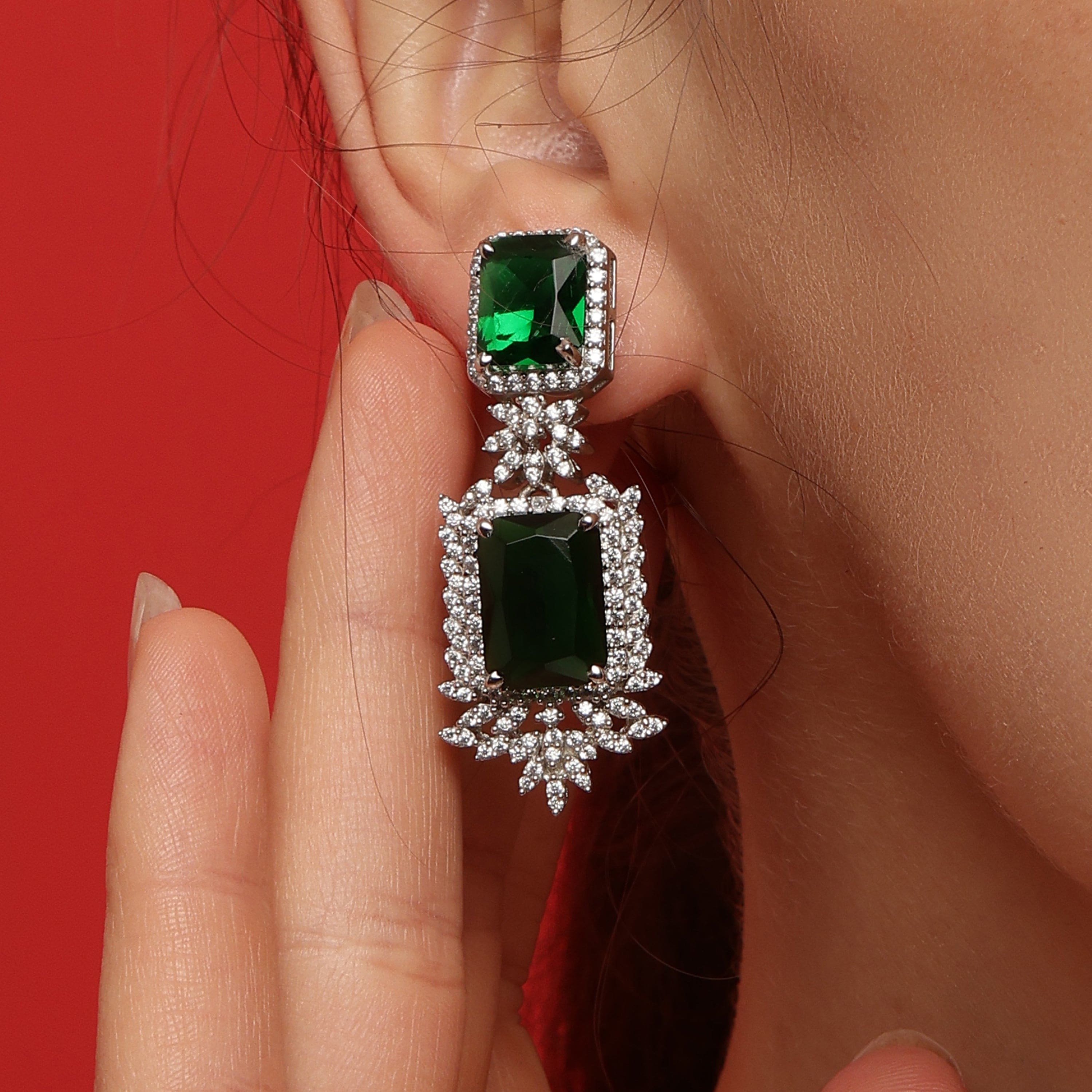 Dangling Emerald sterling silver earrings close-up detail