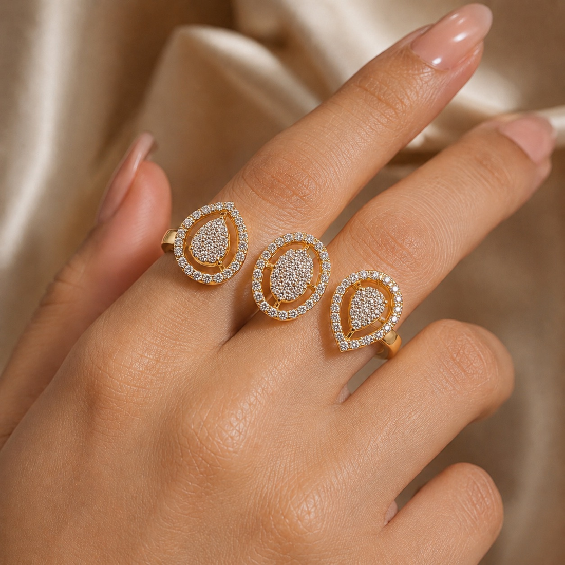 Gold and diamond ring on a hand with a neutral background
