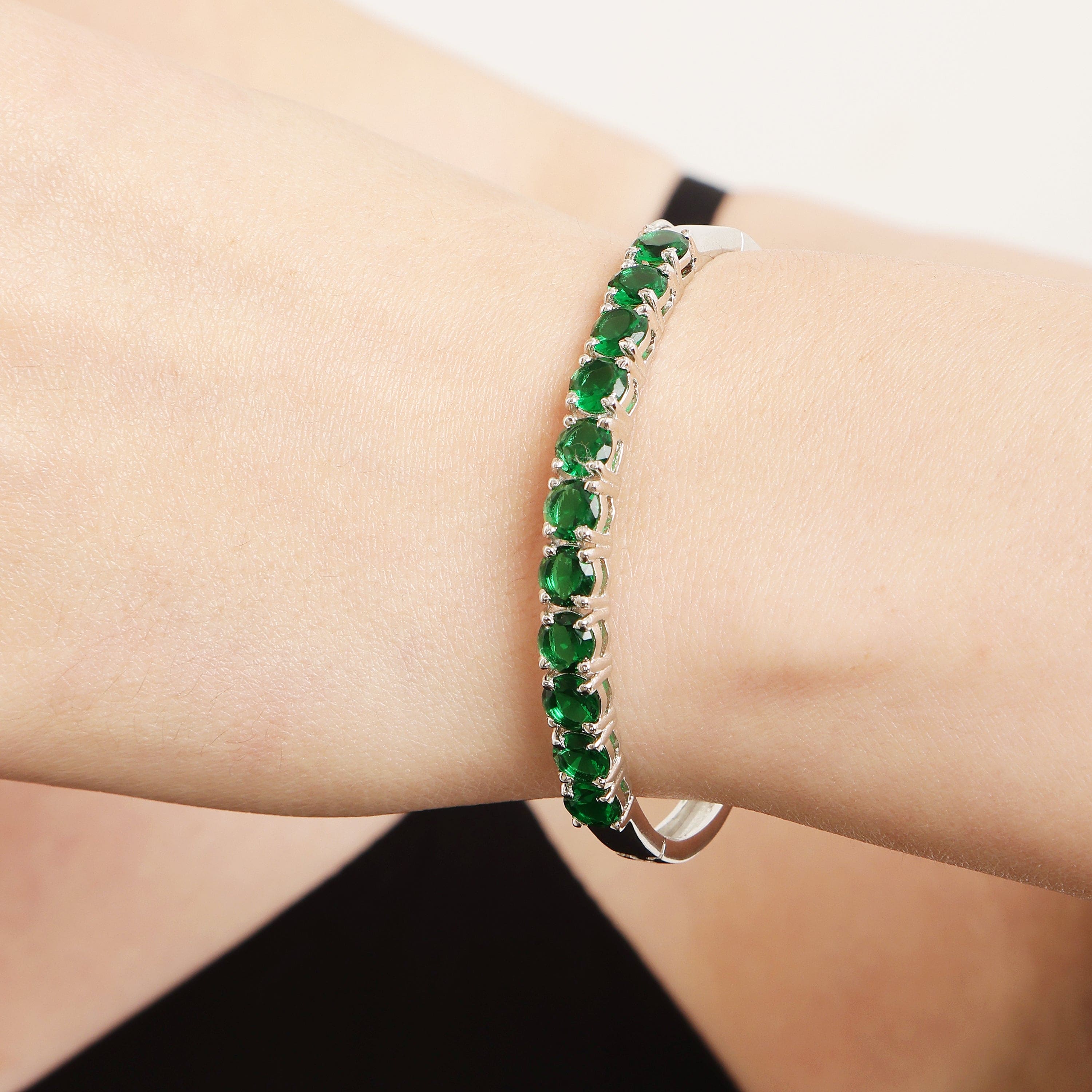 Emerald Linear Charm sterling silver bracelet close-up green stone detail
