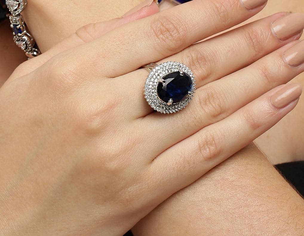 Gleaming Blue Sapphire sterling silver ring worn on hand
