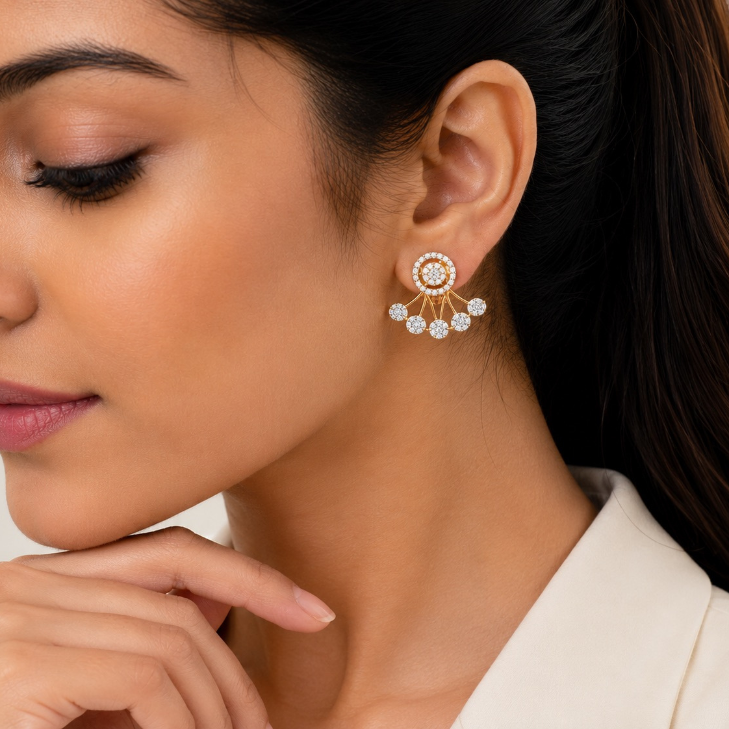 Woman wearing gold ear jacket party wear earrings, round halo fan cluster close-up