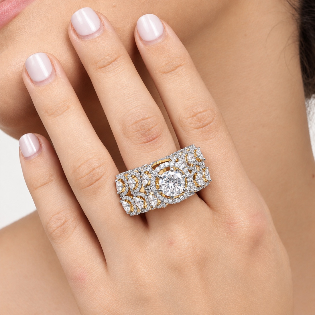 Bridal cocktail ring with sparkling zircon stones on model's finger
