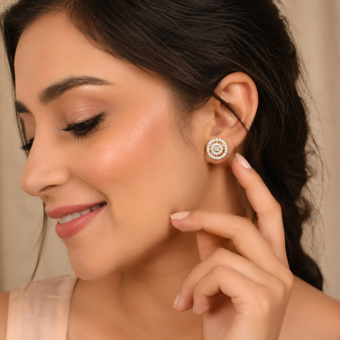 Elegant model wearing gold polish round diamond stud earrings with finger pose, realistic premium jewellery website image