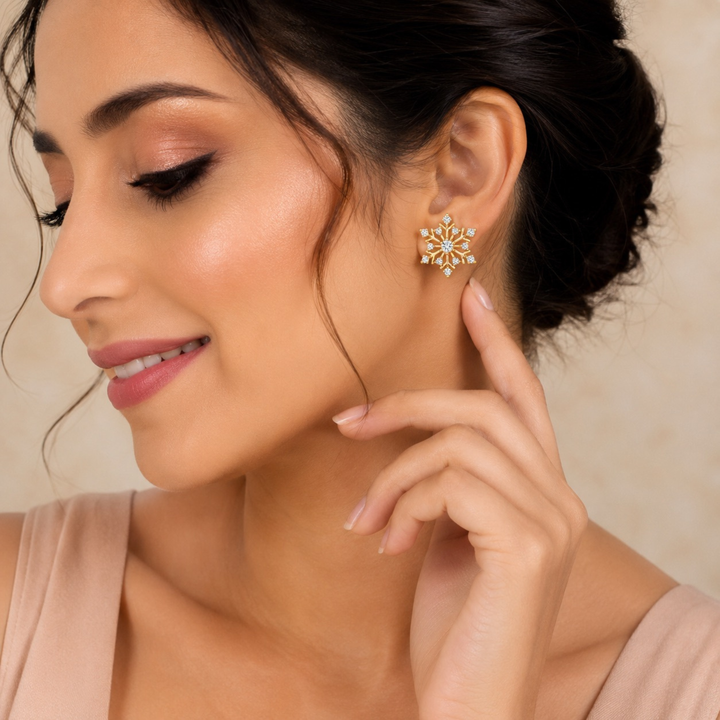 Beautiful model wearing gold polish snowflake diamond stud earrings, realistic luxury jewellery fashion portrait