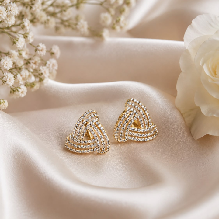 Luxury 925 Sterling Silver gold polish knot stud earrings with sparkling CZ stones creative jewellery photography