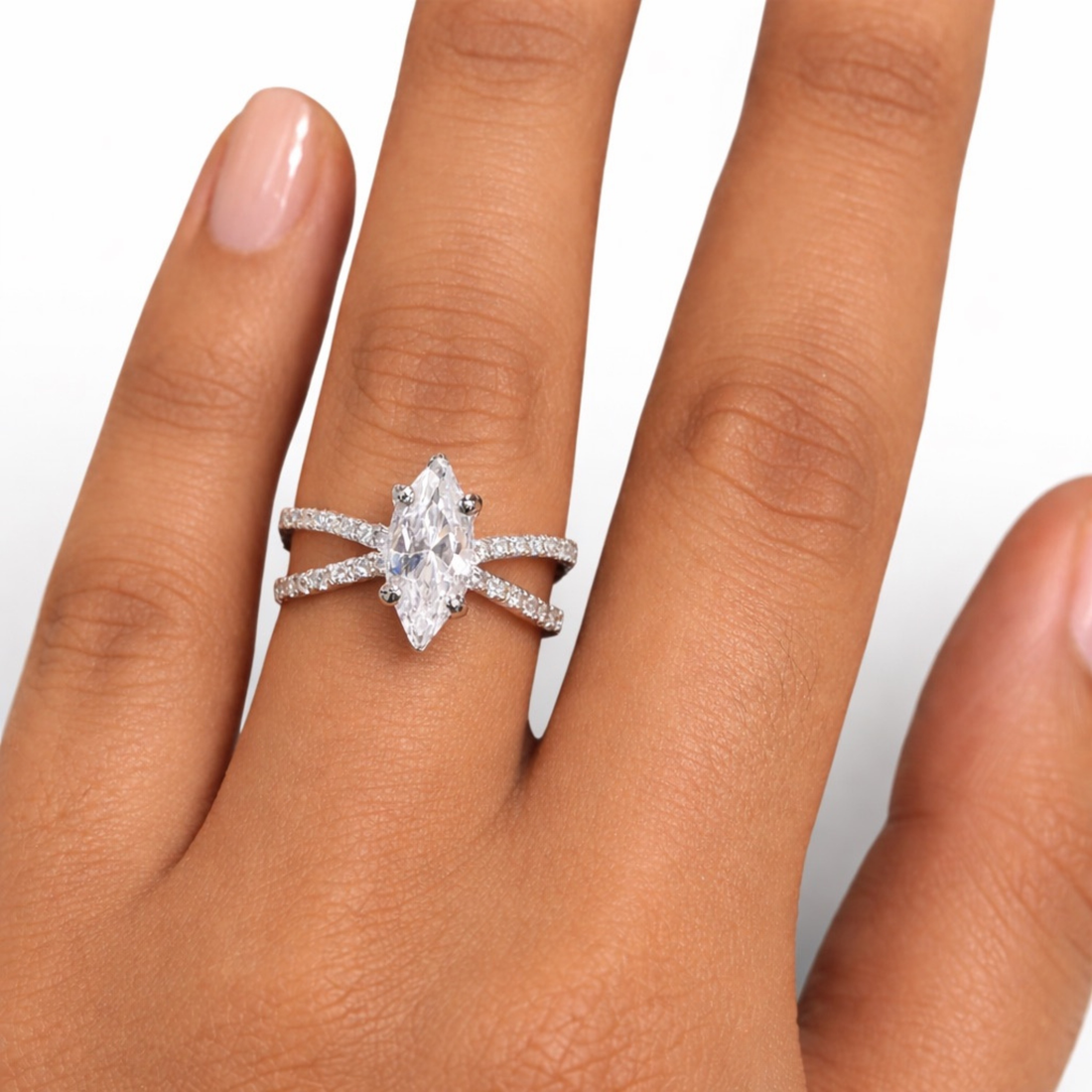     Elegant marquise diamond ring in white polish on white background
