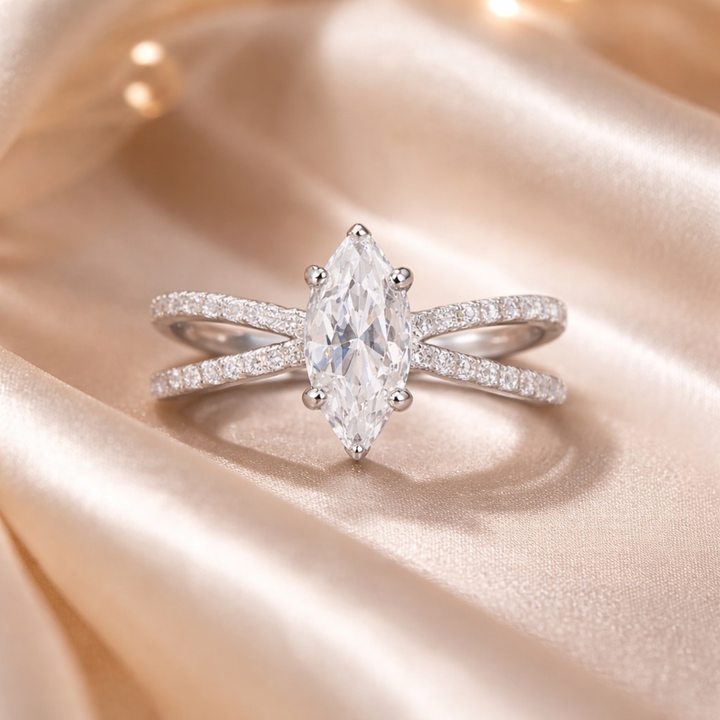     Elegant marquise diamond ring in white polish on beige background