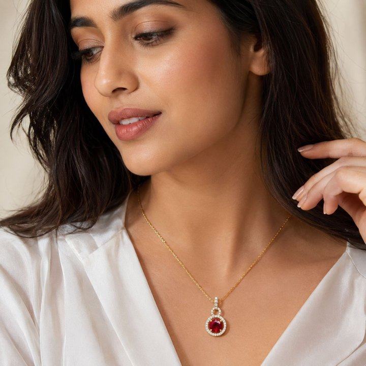     Elegant ruby halo pendant necklace in sterling silver worn for premium jewellery styling