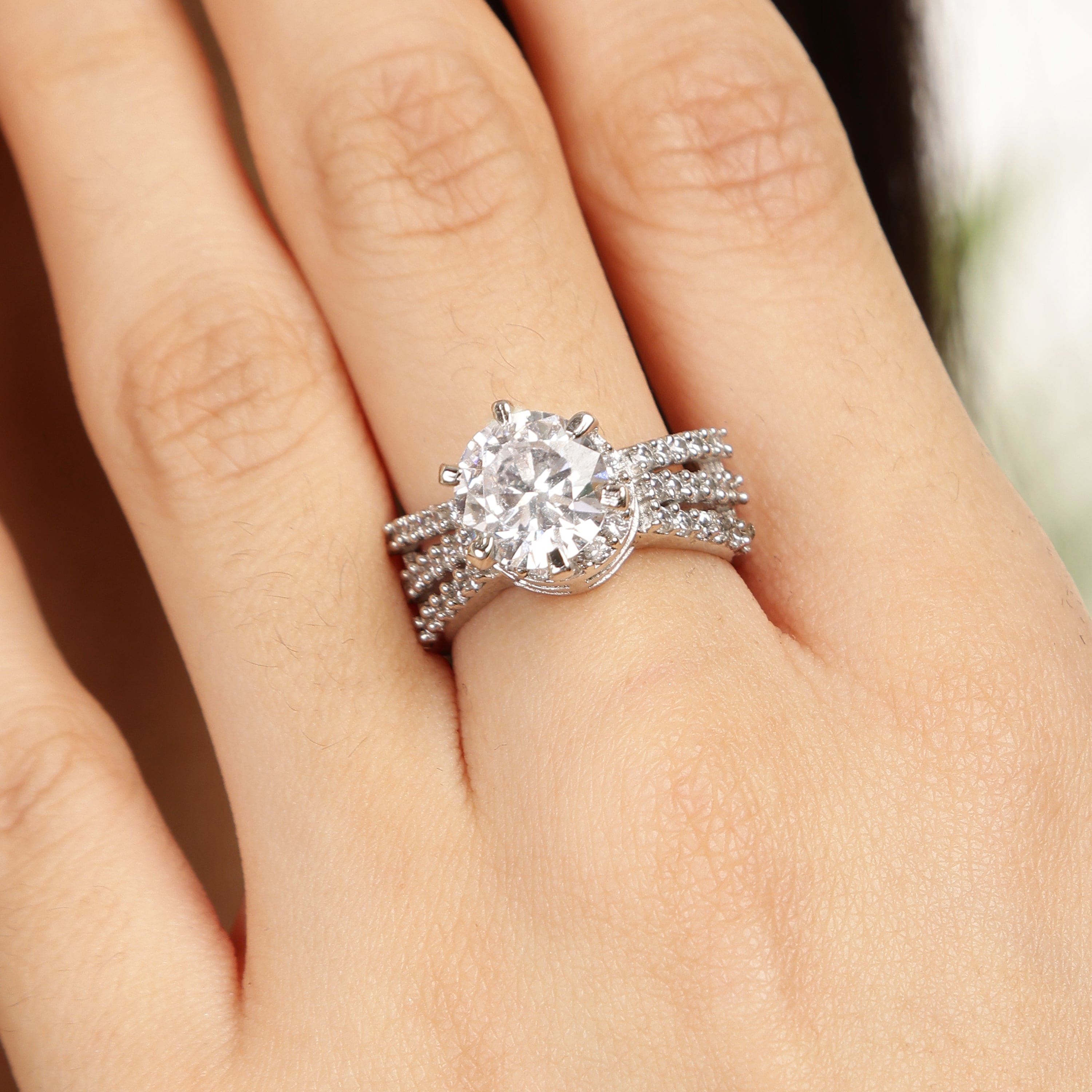 The Vogue Solitaire sterling silver ring worn on hand
